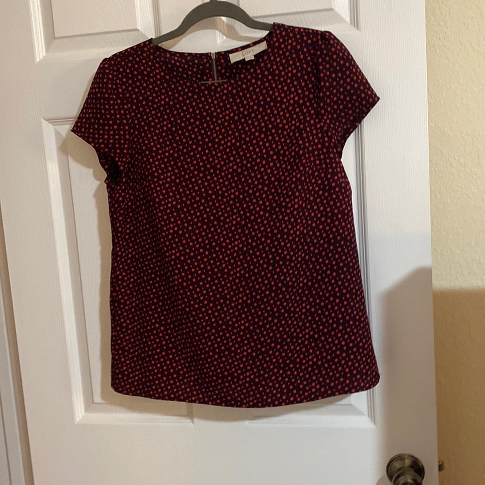 pink dotted black blouse